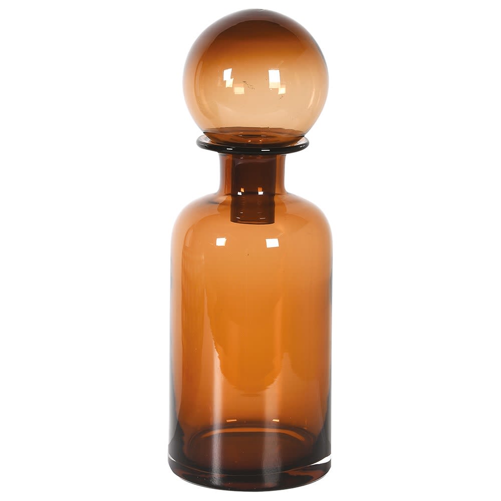 Amber glass bottle with a spherical cap on a white background
