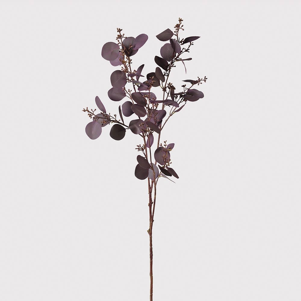 Purple artificial eucalyptus branch on a light gray background