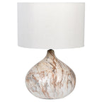 Table lamp with marble base and white shade on a white background