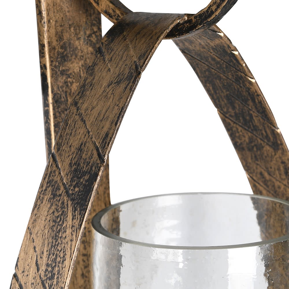 Decorative metal lantern with a glass container on a white background