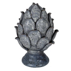 Decorative artichoke-shaped object with a textured surface on a white background