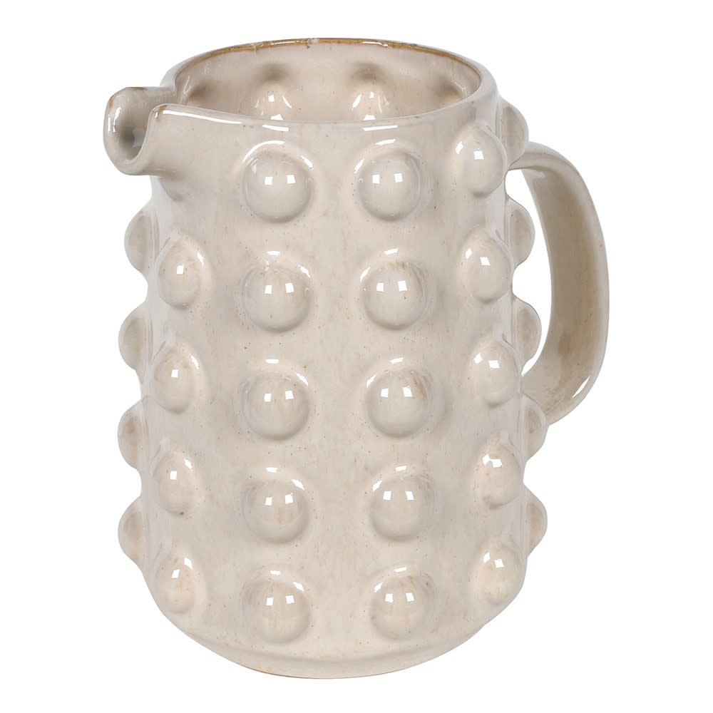 White ceramic pitcher with textured surface on a white background