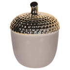 Decorative container with a gold lid on a white background
